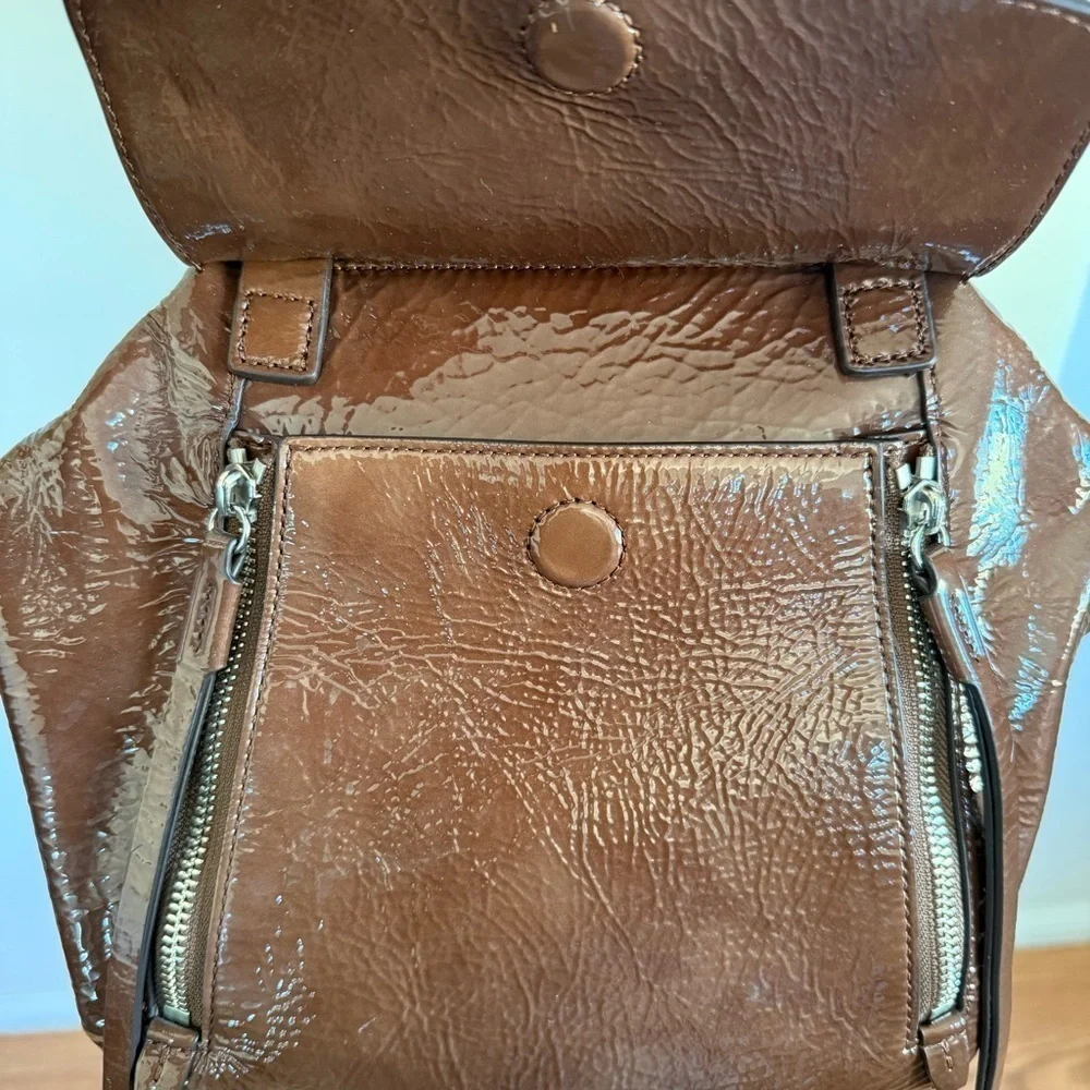 Tory Burch half moon patent leather brown purse with crossbody strap